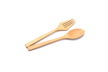 Wooden spoon delicately clean on white background.
