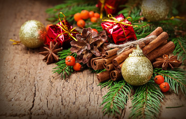 Christmas spices cinnamon sticks, star anise and green tree