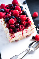 Homemade Pavlova with berry fruits on serving board