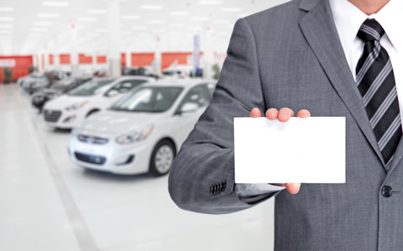 Auto dealer with Business card.