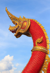 Serpent king or king of naga statue on blue sky in thailand