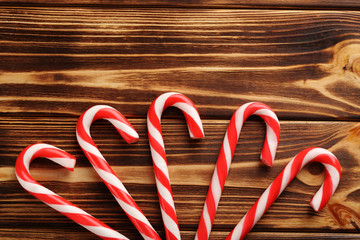 Christmas candy can on a brown wooden table