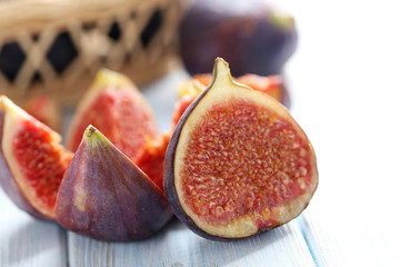 Fresh figs on a blue wooden table