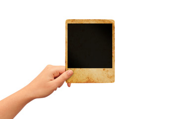 Hand holding blank polaroid photo