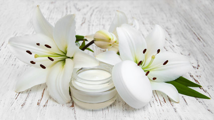 Fototapeta na wymiar Face cream with lily flowers