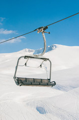 Ski lifts durings bright winter day