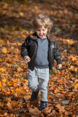 Happy boy running in nature.