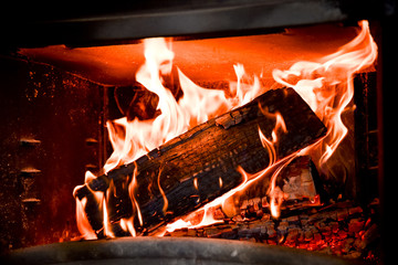 Beatuful flames of wood burning in a fireplace