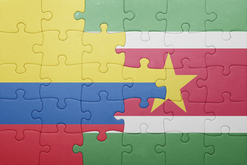 puzzle with the national flag of suriname and colombia