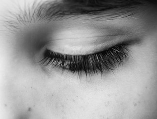 Closed human eye close up studio shot. Child eye.