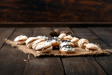 Chocolate cookies on the rustic wooden table.