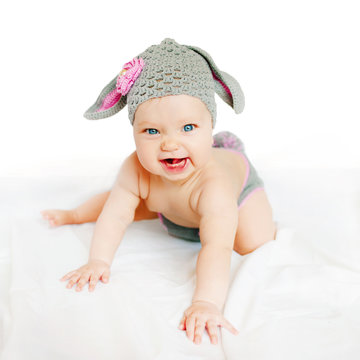 smiling baby in costume bunny or lamb