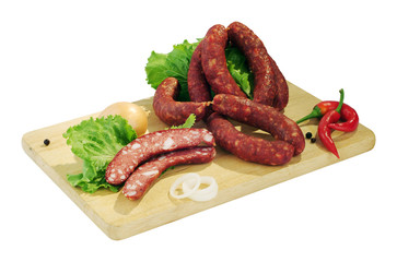 Still life - sausage on the board isolated