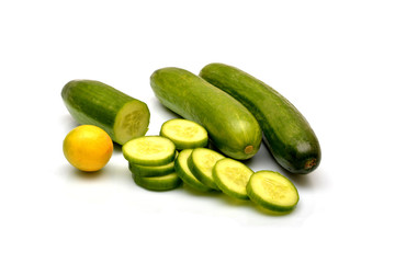 Sliced Cucmber and lemon isolated on white background.
