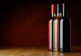 Fototapeta na wymiar row of three wine bottles