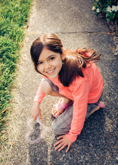 Young girl playing outdoors.