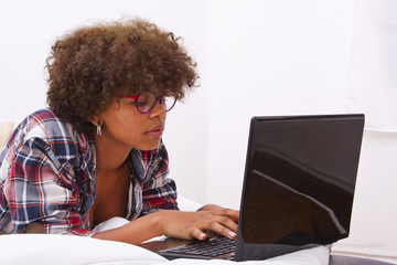 young girl with computer in the room