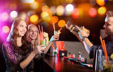 Group of young girls with barman having party celebration.