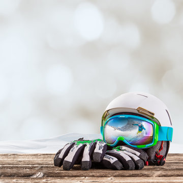Colorful ski glasses, gloves and helmet