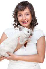 Young woman hugging rabbit