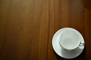 cup of coffee on wood table