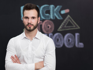 confident young caucasian teacher in a class