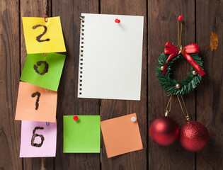 New year 2016 of burned in papernote on a wooden background