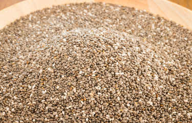 Nutritious chia seeds on a wooden plate