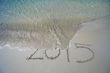 END of Year 2015 written on sand