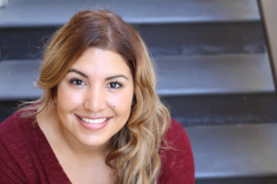 Portrait of a young Hispanic female smiling