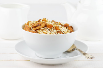 Oatmeal flakes with nuts in bowl