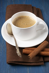 Cup of coffee with cinnamon