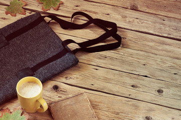 Women's woolen bag with a cup of latte