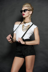 Chic Blonde Fashion Model on Black