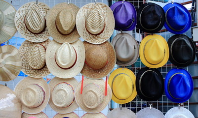 Row Of Vintage Weaving Hats Hanging On The Grille