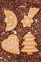 Fresh baked decorated gingerbread and coffee grains, christmas time