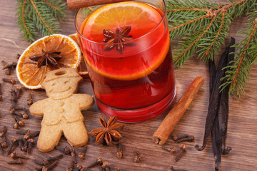 Mulled wine and gingerbread for christmas with spices and spruce branches