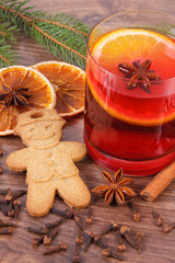 Mulled wine and gingerbread for christmas with spices and spruce branches