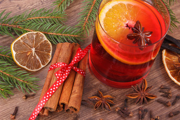 Mulled wine for christmas or winter evening with spices and spruce branches