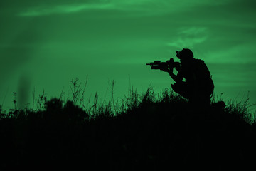 Silhouette of soldier with rifle..