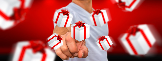 Man celebrating christmas holding gift in his hand