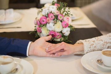 Obraz na płótnie Canvas Closeup of a man holding his girlfriend's hand