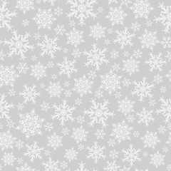 Seamless pattern of snowflakes, white on gray