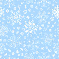 Seamless pattern of snowflakes, white on light blue