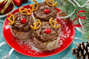 Christmas dessert deer on a festive table, close up and selective focus