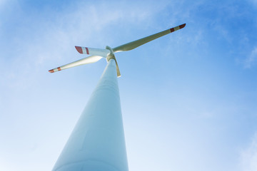 Fototapeta premium wind turbine generating electricity on blue sky