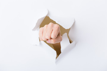 Paper breakthough by woman punch