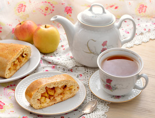 Still life with apple pie and tea.