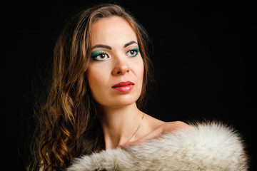 Woman with make-up on a black background