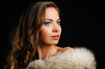 Woman with make-up on a black background